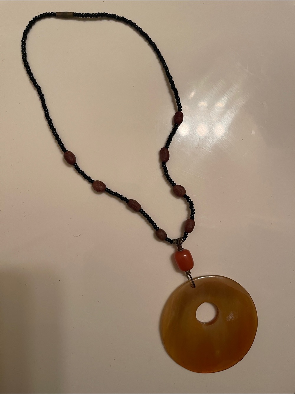 Stylish Women's Bead Necklace with Amber Donut Pendant